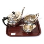 A three piece silver tea service, J & W Deakin, Sheffield 1911/12, the teapot 28cm long, 36.7ozt (