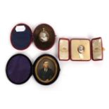 Two photographic portrait miniatures in gold coloured frames and fitted cases; and a further