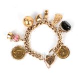 A charm bracelet stamped '9' '.375, hung with a 1906 sovereign, a swivel fob a Gibraltar charm, four