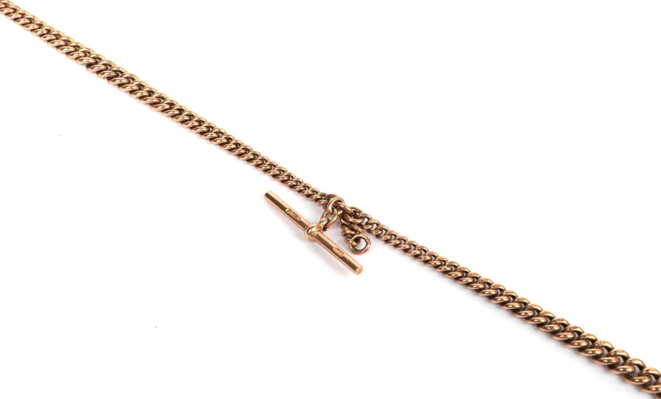 A graduated Albert chain, each link stamped '9' '.375', with a 9 carat gold T-bar . Gross weight -