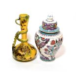 ^ A reproduction Turkish vase and cover in the Isnik style and a George Jones Melrose ware ewer (2)