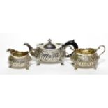 An American silver three piece bachelors tea service, Howard & Co, New York, 21.09ozt