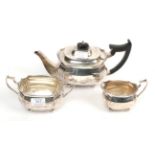 A three piece silver tea service, Edward Barnard & Sons, London 1917/18, the teapot 28.5cm long,