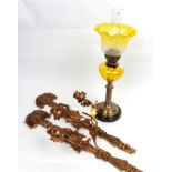 ^ A late Victorian brass oil lamp with yellow tinted glass reservoir and later etched glass yellow