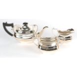 Three piece silver tea service by Jackson & Fullerton, London 1909, retailed by Mackay and Chisholm,