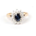 A 9 carat gold sapphire and diamond cluster ring, finger size N. Gross weight 2.68 grams.