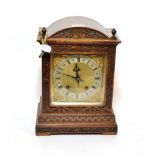 An oak quarter striking mantel clock, movement stamped W&H, retailed by Bowman Limited, London,