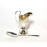 An 18th century silver marrow spoon, marks indistinct London circa 1770; and a helmet shaped