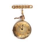 A lady's fob watch, case stamped '18K', with attached 9 carat gold curb link brooch