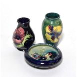 A Moorcroft Spring Flowers pattern circular shallow bowl; a hibiscus pattern vase; and an anenome