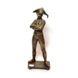 ^ A modern bronze figure of a boy standing with arms crossed, 54cm high