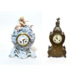 A ceramic encrusted striking mantel clock and a floral decorated striking mantel clock (2)