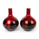 A pair of Royal Doulton Flambe bottle vases, shape number 1618