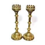 ^ A pair of brass ecclesiastical candlesticks, 50cm high