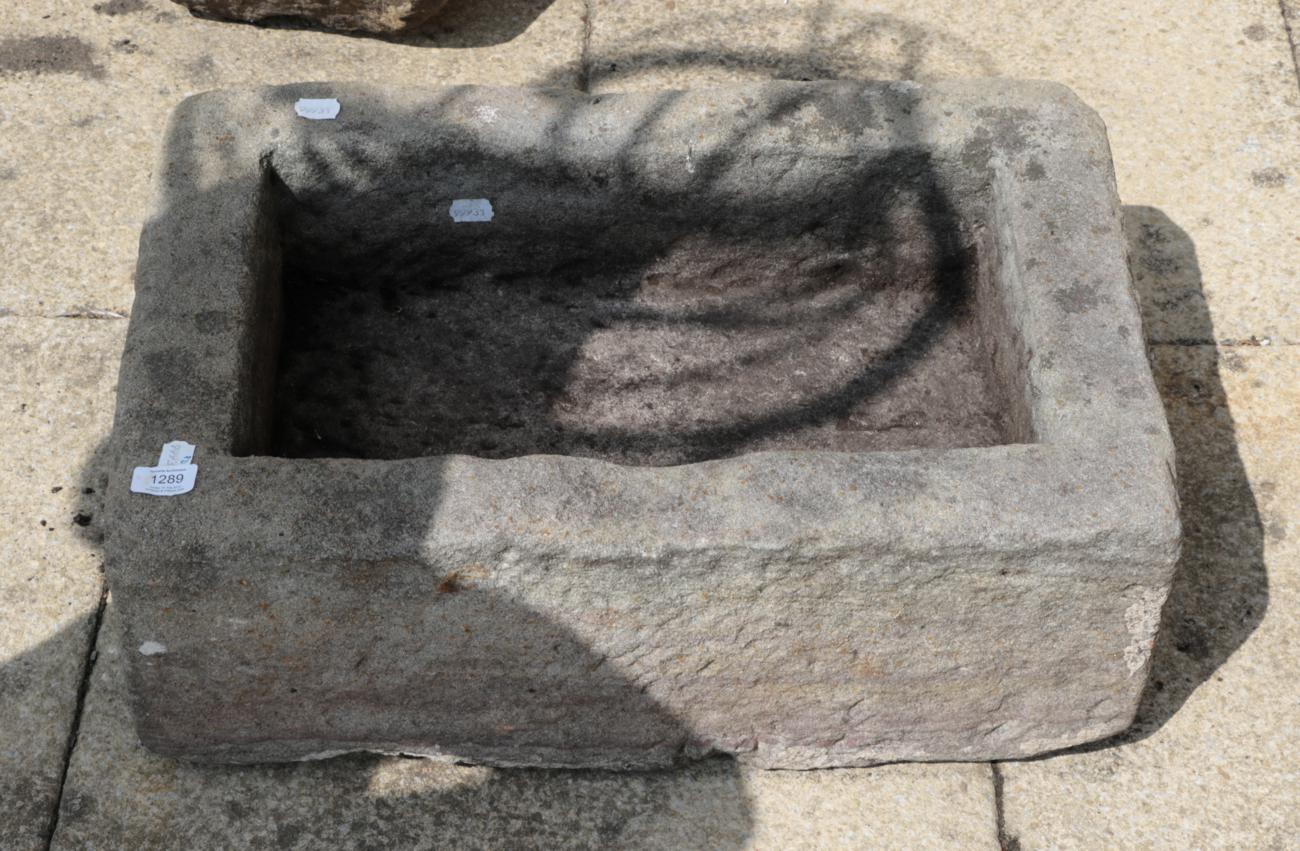 A rectangular stone garden trough, 63cm wide