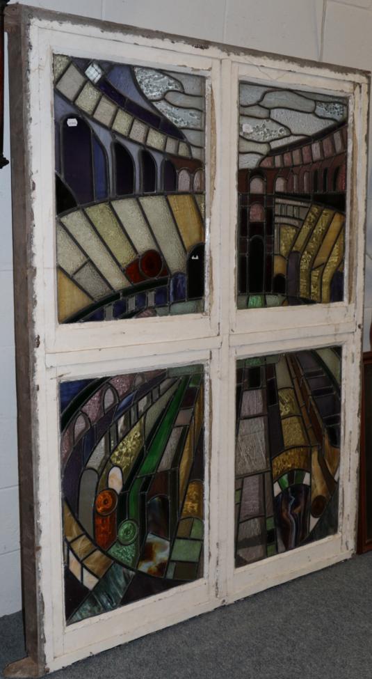 A four panel stained glass window depicting the Colosseum, Rome One panel - 73cm by 53cm. Overall