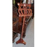 A Victorian walnut music stand, with spiral turned support, 135cm high