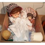 A Heubach Koppelsdorf 320.3.doll, a Rosebud doll, two other dolls and a circa 1965 John Lennon