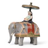 Britains Early Friction Elephant slush cast in lead with seated figure beneath gyroscopic