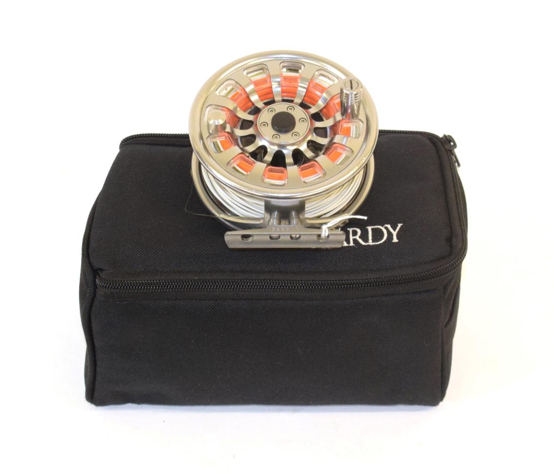 A Hardy Demon 7000 aluminium fly reel, serial No. J18385, fitted with line, with two spare spools,