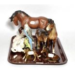 A Royal Doulton Shire horse; Beswick Budgie; Royal Doulton Rearing Stallion; four Beswick horses (