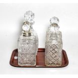 A silver mounted decanter stamped Aspreys London, a Waterford decanter and a pair of decanters