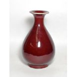 A Chinese sang de boeuf, baluster vase with everted rim