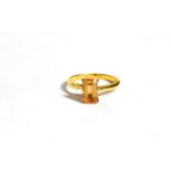 An topaz dress ring, stamped '18CT', finger size N. Gross weight 3.3 grams.