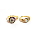 An 18 carat gold opal and diamond ring, finger size K1/2; and a garnet and opal cluster ring,