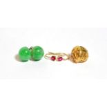 A pair of jade stud earrings, unmarked; a pair of red stone earrings, unmarked; and pair of 9