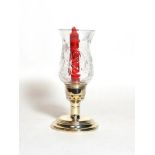 An Elizabeth II silver candlestick with silver-mounted glass shade, filled, the base by Mappin and