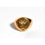 A signet ring with seal engraved, unmarked, finger size J. Gross weight 10.9 grams.