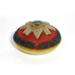 An early 20th century beadwork pin cushion to the Scots Guards, of circular form, worked with the