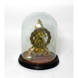 A brass skeleton mantel timepiece, chapter ring signed Smith, London, beneath glass dome