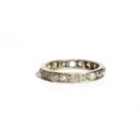 A diamond eternity ring, one stone deficient, finger size M1/2. Gross weight 3.8 grams.