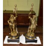 A pair of gilt brass figural lamp bases, 20th century, modelled as a Renaissance soldier and a