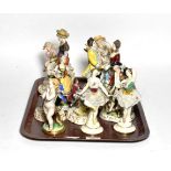 A group of continental porcelain figures including ballerinas, shepherd and shepherdess, dancing