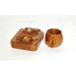 A Robert 'Mouseman' Thomspon oak ashtray and a similar napkin ring, each carved with mouse