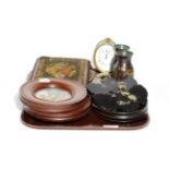 Oval brass desk timepiece; two framed Shakespeare pot lids; zig-zag corkscrew; two Victorian