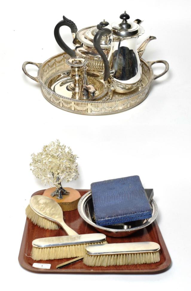 Circular plated gallery tray; teapot; coffee pot; teaspoons; chamberstick; silver mounted brush set;