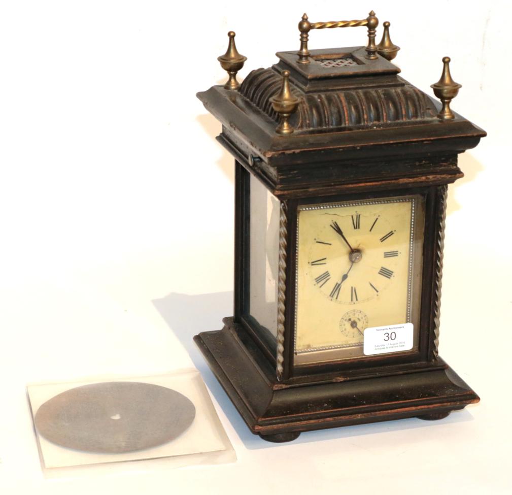 A musical alarm mantel timepiece, with three symphonium discs The case is rubbed. The edges are