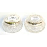 Two Elizabeth II silver-mounted cut-glass dressing-table jars, the silver mounts by Barker