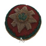 An early 20th century beadwork pin cushion to the Scots Guards, of circular form, worked with the