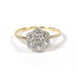 A diamond cluster ring, finger size L. The ring is in fair condition, the shank is worn. The