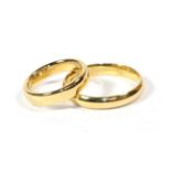 Two 18 carat gold band rings, finger sizes L and W (2) . Gross weight 11.99 grams.