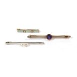 Three bar brooches including an amethyst example; and a sapphire and pearl hoop brooch with