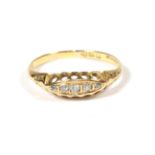 An 18 carat gold diamond five stone ring, finger size P. Gross weight - 2.29 grams.