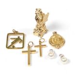 Two 18 carat white gold cultured pearl pendants; and five 9 carat gold pendants/charms including two