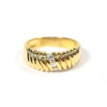 An 18 carat gold diamond three stone ring, total estimate diamond weight 0.15 carat approximately,