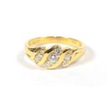 An 18 carat gold diamond twist ring, finger size P. Gross weight 4.47 grams.